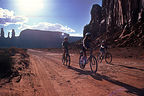 Lolo and the boys biking through Monument Valley Lolo and the boys biking through Monument Valley